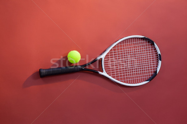 Overhead view of fluorescent yellow tennis ball on racket Stock photo © wavebreak_media
