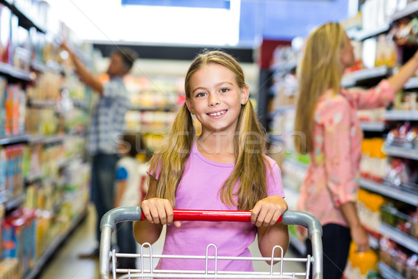 Uśmiechnięty dziecko rodziny supermarket działalności człowiek Zdjęcia stock © wavebreak_media