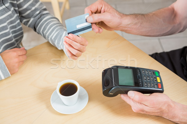 Woman making payment through credit card Stock photo © wavebreak_media