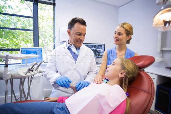 Dentist interacting with young patient Stock photo © wavebreak_media