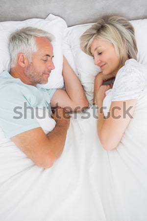 Woman lying in bed with a boy smiling at the camera Stock photo © wavebreak_media