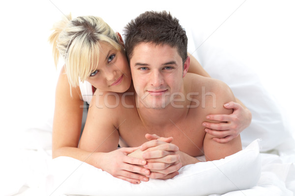 Amoroso casal relaxante cama menina Foto stock © wavebreak_media