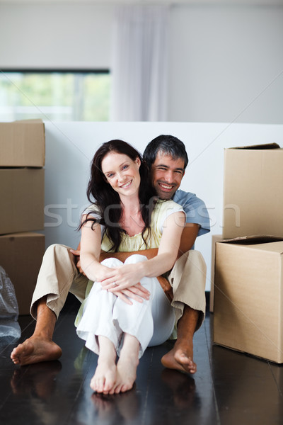 Smiling couple sitting in their new house Stock photo © wavebreak_media