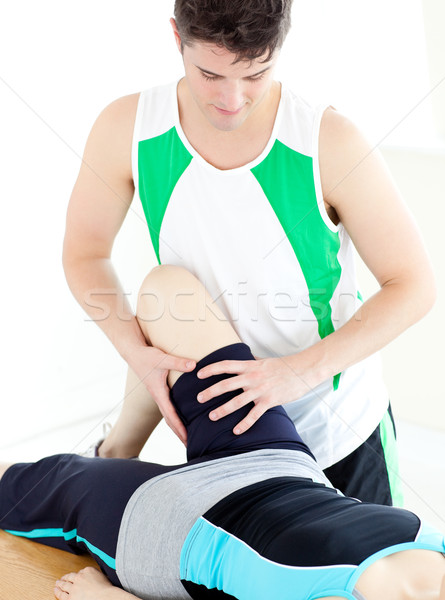 Assertive male physical therapist checking a woman's leg  Stock photo © wavebreak_media