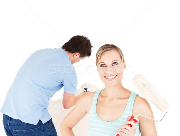 Positif couple peinture chambre maison [[stock_photo]] © wavebreak_media