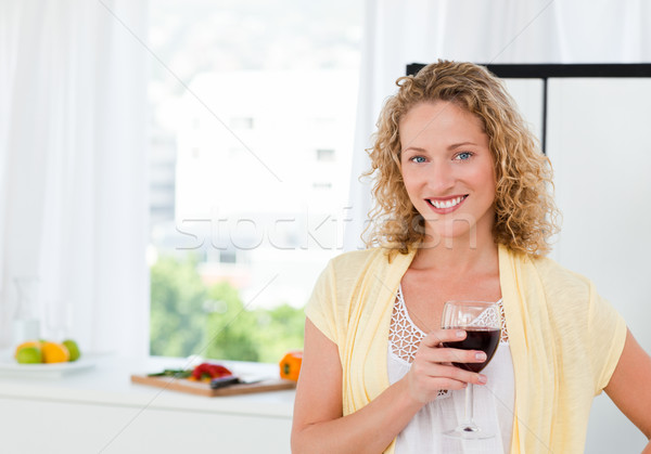 Woman looking at the camera with her drink of wine Stock photo © wavebreak_media