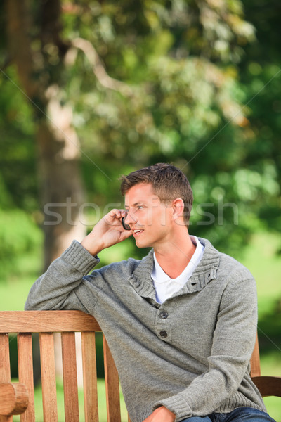 Man phoning on the bench Stock photo © wavebreak_media