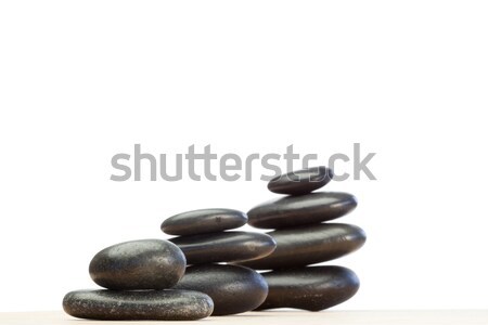 Differents piled up pebbles on a white background Stock photo © wavebreak_media