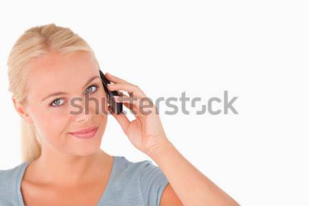 Cute smiling woman on the phone in a studio Stock photo © wavebreak_media