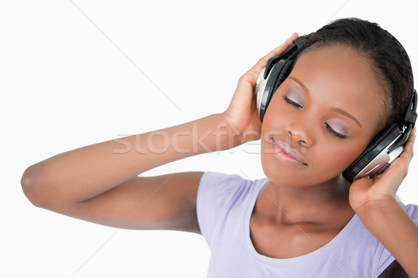 Femme souriante casque blanche musique fond [[stock_photo]] © wavebreak_media