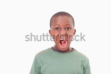 Boy with the mouth open against a white background Stock photo © wavebreak_media