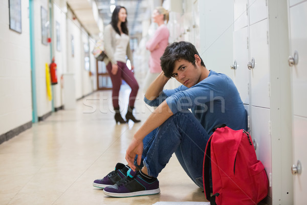Stock photo: Man sitting on the floor at the hallway