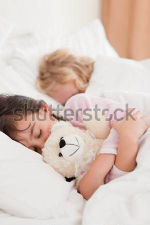 Calm family sleeping together Stock photo © wavebreak_media