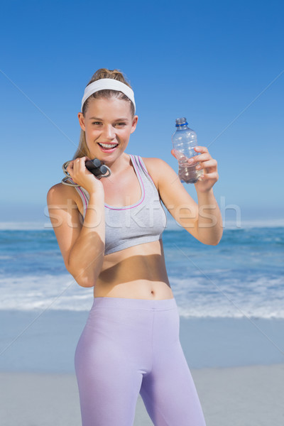 Heureux permanent plage une bouteille d'eau [[stock_photo]] © wavebreak_media