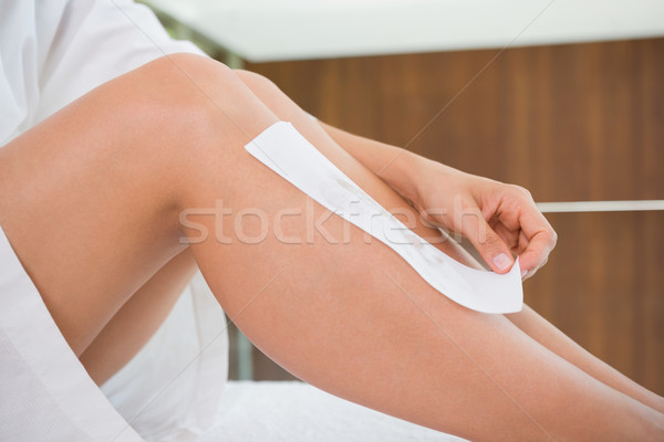 Woman waxing her legs herself Stock photo © wavebreak_media