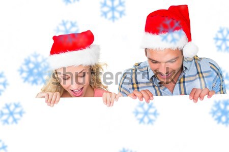 Festive redhead smiling at camera Stock photo © wavebreak_media