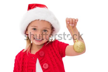Stock photo: Cute little girl wearing santa hat holding bauble