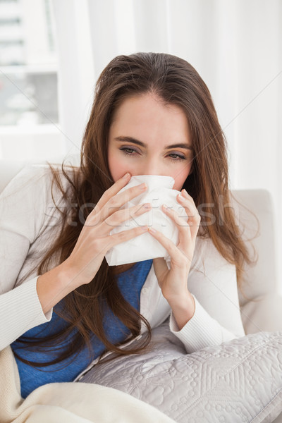 Sick brunette on the couch Stock photo © wavebreak_media