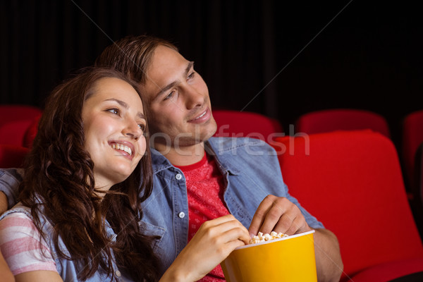 Stock photo: Young couple watching a film