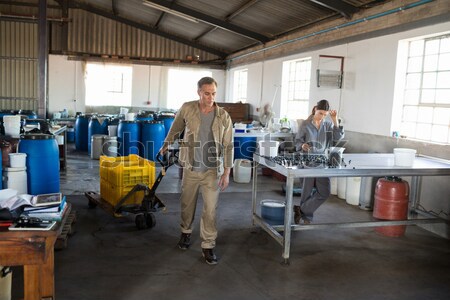 Team of technicians using digital cable analyser on servers Stock photo © wavebreak_media