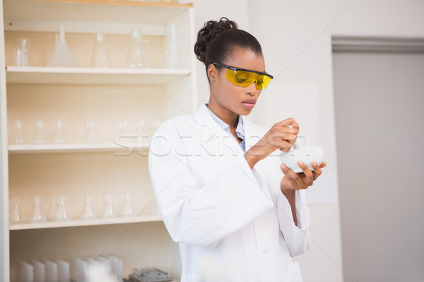 Concentrated scientist using pestle and mortar Stock photo © wavebreak_media