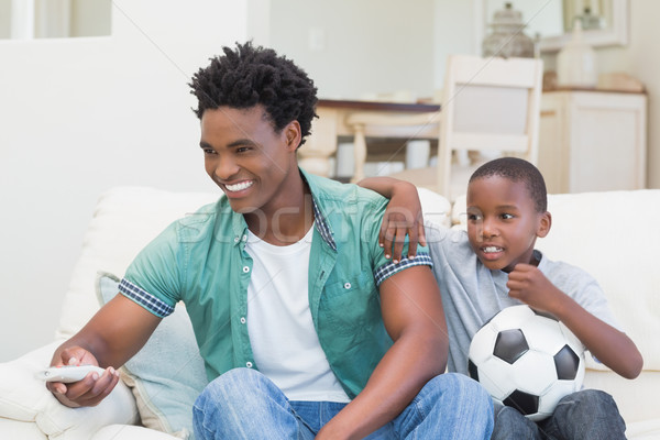 Père en fils regarder tv ensemble canapé maison [[stock_photo]] © wavebreak_media