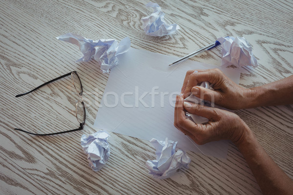 Hands of businesswoman crumpling papers on desk in office Stock photo © wavebreak_media