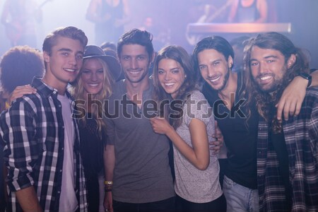 Portrait of friends enjoying at nightclub Stock photo © wavebreak_media