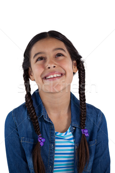 Smiling girl against white background Stock photo © wavebreak_media