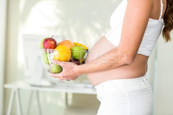 Vue de côté femme femme enceinte maison [[stock_photo]] © wavebreak_media