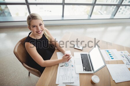 Portrait of female designer checking fabric Stock photo © wavebreak_media
