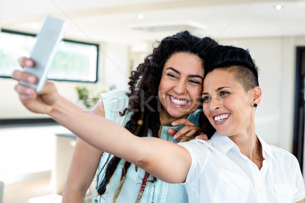 Lesbian couple taking a selfie on phone Stock photo © wavebreak_media