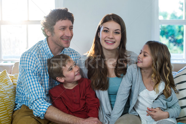 Portrait famille heureuse séance canapé maison homme [[stock_photo]] © wavebreak_media