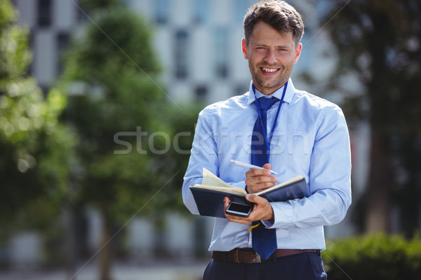 Przystojny biznesmen piśmie mleczarnia portret miłości Zdjęcia stock © wavebreak_media