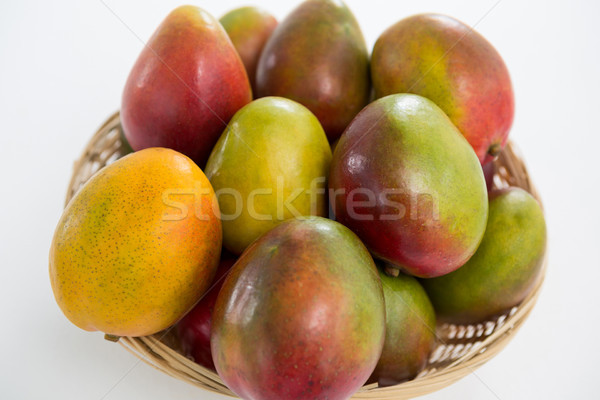 Close-up of red mangoes in wicker basket Stock photo © wavebreak_media