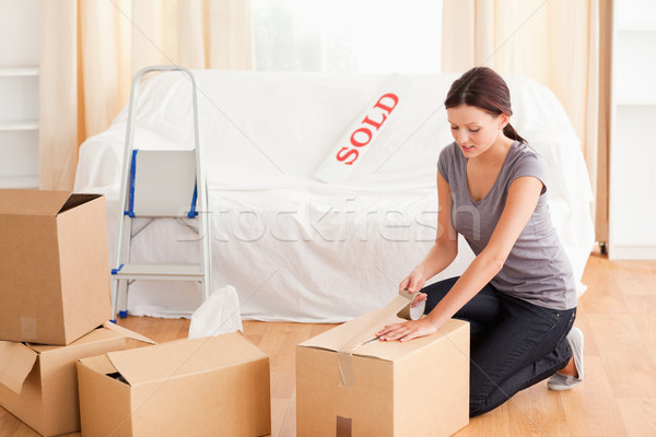 A female is preparing cardboards for the transport Stock photo © wavebreak_media