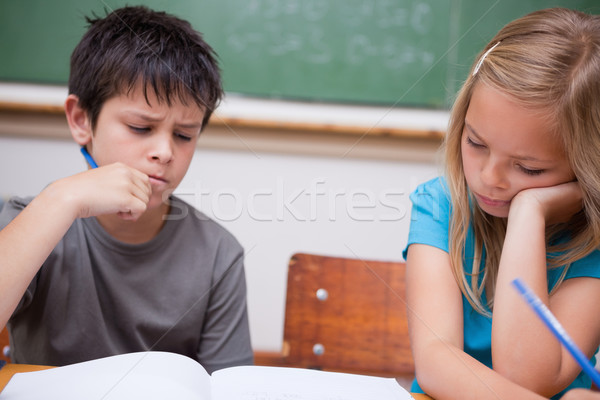 Thoughtful pupils working together in a classroom Stock photo © wavebreak_media