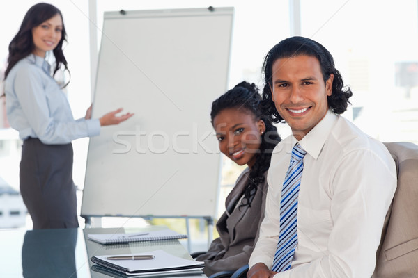 Two executives sitting at a desk in a meeting room during a presentation Stock photo © wavebreak_media