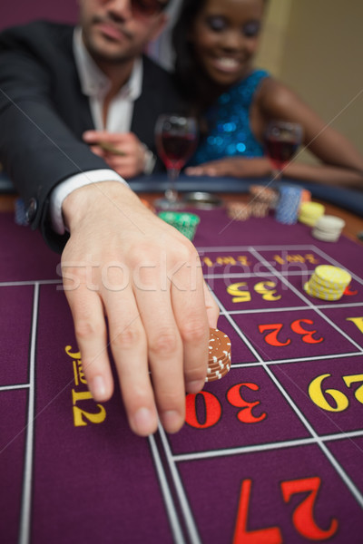 Man placing bet on roulette in casino Stock photo © wavebreak_media