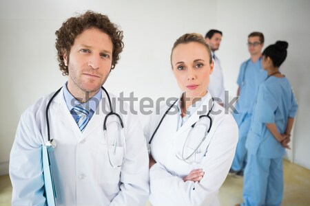 Doctor and his team of nurses smiling Stock photo © wavebreak_media
