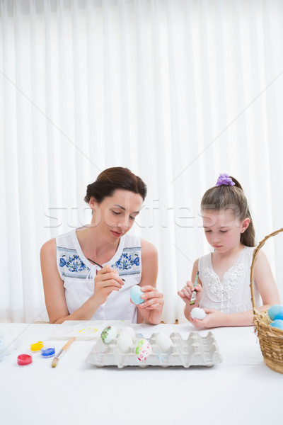 Mother and daughter painting easter eggs Stock photo © wavebreak_media