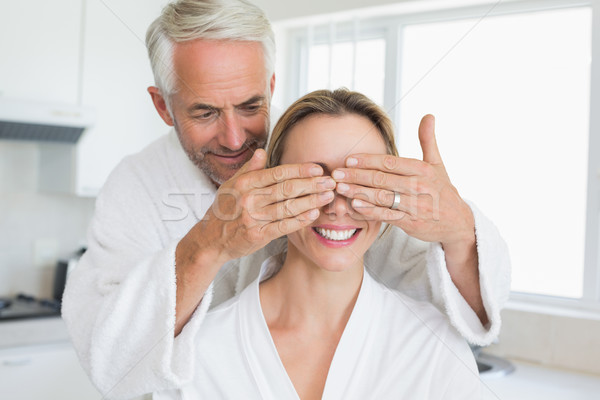 Happy man covering his partners eyes in the morning Stock photo © wavebreak_media