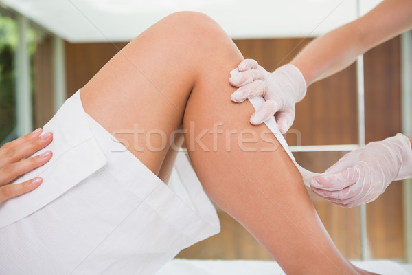 Woman getting her legs waxed by beauty therapist Stock photo © wavebreak_media