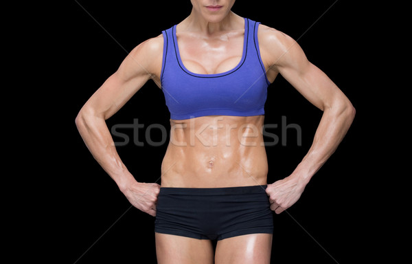 Fuerte mujer posando deportes sujetador shorts Foto stock © wavebreak_media