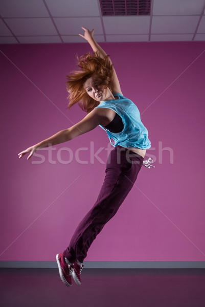 Pretty break dancer leaping mid air Stock photo © wavebreak_media