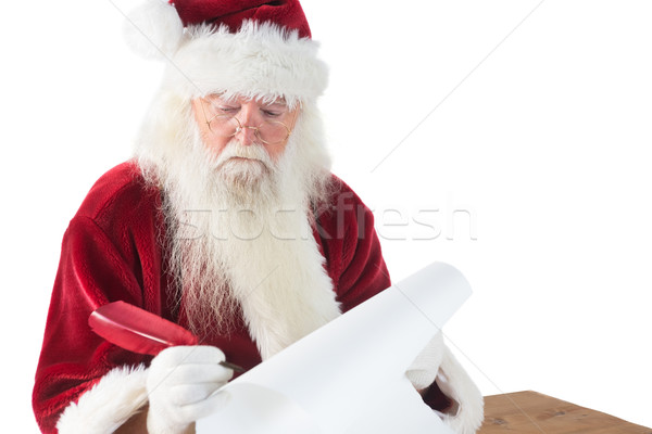 Santa writes something with a feather Stock photo © wavebreak_media