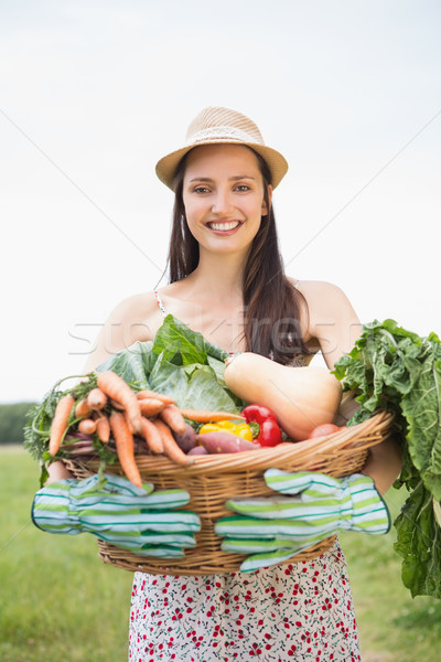 Pretty woman with basket of veg Stock photo © wavebreak_media