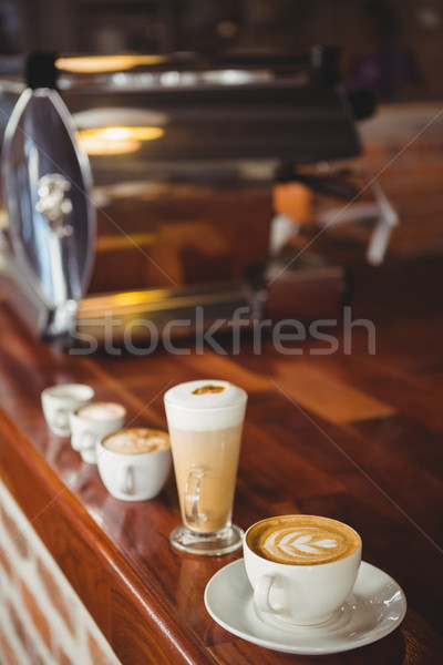 Several hot beverages in a row on the counter Stock photo © wavebreak_media