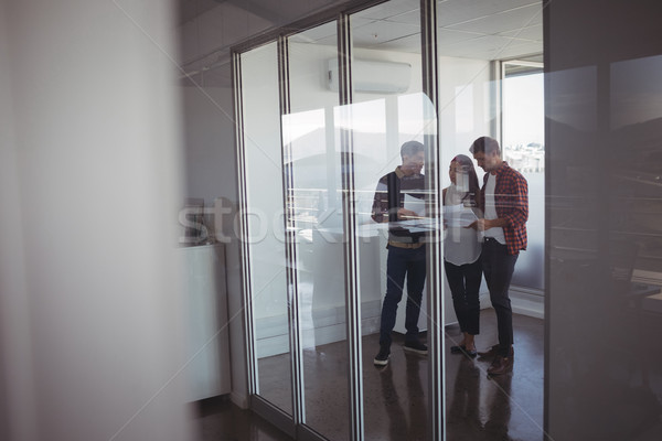 Business colleagues dicussing over documets at office Stock photo © wavebreak_media