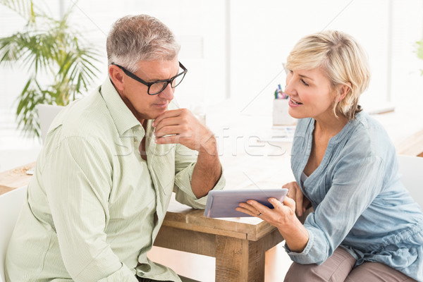 Attentive business team working over a tablet Stock photo © wavebreak_media